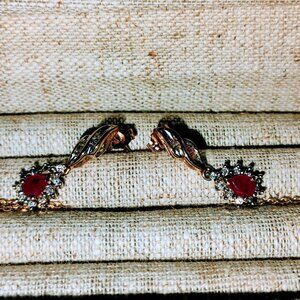 Ruby and diamond dangling earrings in 10k yellow gold